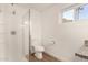 Bathroom with walk-in shower, modern toilet, and granite countertop at 407 E Eason Ave, Buckeye, AZ 85326
