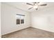Bedroom with carpet and ceiling fan at 407 E Eason Ave, Buckeye, AZ 85326