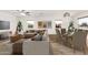 Beautifully staged open-concept living room, with a dining area, and plenty of seating at 407 E Eason Ave, Buckeye, AZ 85326