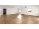 Spacious open-concept living room with sleek wood floors and lots of natural light at 407 E Eason Ave, Buckeye, AZ 85326