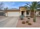 Charming single-story home featuring desert landscaping, a two-car garage, and a welcoming entrance at 411 W Gascon Rd, San Tan Valley, AZ 85143