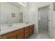 Bright bathroom featuring double sinks, neutral colors, and a separate toilet room at 4429 W Paseo Way, Laveen, AZ 85339