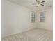 Carpeted bedroom featuring a ceiling fan and two windows with bright natural light at 4429 W Paseo Way, Laveen, AZ 85339