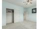 The bedroom boasts neutral carpeting, a closet, a ceiling fan, and modern paint at 4429 W Paseo Way, Laveen, AZ 85339