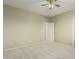 Bedroom featuring plush carpet, a ceiling fan, and doorway to another room at 4429 W Paseo Way, Laveen, AZ 85339