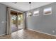 Bright dining area with tiled flooring and a sliding glass door to the backyard at 5140 S Eucalyptus Dr, Gilbert, AZ 85298