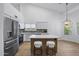 Bright kitchen featuring stainless steel appliances, a large island, and modern white cabinets at 567 W Laredo Ave, Gilbert, AZ 85233