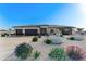 Charming single-story home with desert landscaping, three-car garage, and a neutral color scheme at 7259 S 221St Ave, Buckeye, AZ 85326