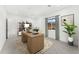 Bright home office with neutral paint, wooden desk, stylish decor, and window with scenic views at 7259 S 221St Ave, Buckeye, AZ 85326