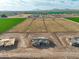New construction home with a sprawling lot, framed by picturesque farmland and distant mountain views at 7271 S 221St Ave, Buckeye, AZ 85326