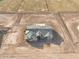 Aerial view of new construction home with gray roof, offering privacy and the potential for landscaping at 7271 S 221St Ave, Buckeye, AZ 85326