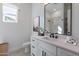 Modern bathroom features sleek vanity, stylish fixtures, and a large mirror, creating a luxurious space at 7271 S 221St Ave, Buckeye, AZ 85326
