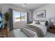 Inviting bedroom offers a bright atmosphere, desert views, and a relaxing space with stylish accents at 7271 S 221St Ave, Buckeye, AZ 85326