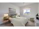 Bright bedroom features a large window with desert views and a cozy bed with stylish decor at 7271 S 221St Ave, Buckeye, AZ 85326