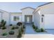 Inviting front entrance with desert landscaping, showcasing the home's architectural details and curb appeal at 7271 S 221St Ave, Buckeye, AZ 85326