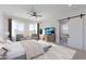 Serene main bedroom featuring large windows with mountain views and an en-suite bathroom with a soaking tub at 7271 S 221St Ave, Buckeye, AZ 85326