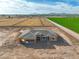 A picturesque aerial view of a new home construction site, showcasing its scenic surroundings and mountain backdrop at 7295 S 221St Ave, Buckeye, AZ 85326