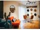 Stylish dining area featuring a unique hat display, round glass table, and seating for four at 7740 E Heatherbrae Ave # 5, Scottsdale, AZ 85251