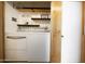 Well-organized laundry room featuring modern washer and dryer, with storage at 7740 E Heatherbrae Ave # 5, Scottsdale, AZ 85251