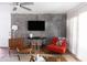 Cozy living room featuring exposed brick, terracotta tile, comfortable seating, and modern decor at 7740 E Heatherbrae Ave # 5, Scottsdale, AZ 85251