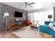 Inviting living room features exposed brick, terracotta tile, comfortable seating, and modern decor at 7740 E Heatherbrae Ave # 5, Scottsdale, AZ 85251