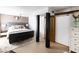 Spacious main bedroom with exposed brick wall and access to ensuite bath at 7740 E Heatherbrae Ave # 5, Scottsdale, AZ 85251
