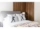 This main bedroom boasts a decorative wood accent wall and southwestern accents at 7740 E Heatherbrae Ave # 5, Scottsdale, AZ 85251