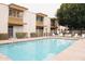 Community pool with lounge chairs, showcasing outdoor amenities at 7740 E Heatherbrae Ave # 5, Scottsdale, AZ 85251