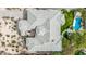 Bird's eye view showcases tile roof, desert landscaping, and patio areas of a custom home at 7829 E Softwind Dr, Scottsdale, AZ 85255