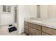 A well-lit bathroom featuring a vanity with a sink and a walk-in shower at 7829 E Softwind Dr, Scottsdale, AZ 85255
