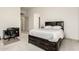 Bedroom with dark wood bed frame featuring built-in drawers and bookshelf at 7829 E Softwind Dr, Scottsdale, AZ 85255
