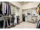 Spacious walk-in closet with custom shelving and rods provides ample storage at 7829 E Softwind Dr, Scottsdale, AZ 85255