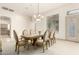 Bright dining area with a chandelier, decorative window, and elegant chairs at 7829 E Softwind Dr, Scottsdale, AZ 85255