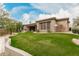 Beautiful single-story home with well-maintained landscaping and a spacious front yard at 7829 E Softwind Dr, Scottsdale, AZ 85255