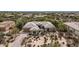 Stunning aerial view of custom home with desert landscaping and charming courtyard entry at 7829 E Softwind Dr, Scottsdale, AZ 85255