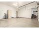 Spacious garage with epoxy floor and plenty of room for storage and parking at 7829 E Softwind Dr, Scottsdale, AZ 85255