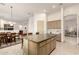 Open layout featuring the kitchen with a large center island and an adjacent dining area at 7829 E Softwind Dr, Scottsdale, AZ 85255