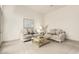 Comfortable living room featuring sofas, artwork, and neutral-toned decor at 7829 E Softwind Dr, Scottsdale, AZ 85255