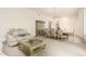 Open-concept living space with a dining area, sofa, and decorative furniture at 7829 E Softwind Dr, Scottsdale, AZ 85255