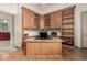 A spacious home office with ample built-in cabinetry and a dedicated workspace at 7829 E Softwind Dr, Scottsdale, AZ 85255