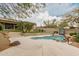 Backyard with a pool surrounded by desert landscaping at 7829 E Softwind Dr, Scottsdale, AZ 85255