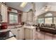 Well-equipped kitchen area with stainless steel sink overlooking a cozy sitting area at 8700 E University Dr # 512, Mesa, AZ 85207