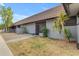 Attractive single-story home featuring desert landscaping, a tiled roof and neutral colors at 9011 W Elm St # 2, Phoenix, AZ 85037