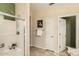 Bathroom featuring a glass-enclosed shower and tile flooring at 10762 W Cimarron Dr, Peoria, AZ 85373