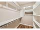 Walk-in closet with custom shelving offers ample storage space at 10762 W Cimarron Dr, Peoria, AZ 85373