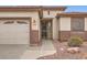 Inviting home entrance with desert landscaping and a secure screen door at 10762 W Cimarron Dr, Peoria, AZ 85373