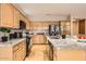 Spacious kitchen featuring stainless steel appliances and granite countertops at 10762 W Cimarron Dr, Peoria, AZ 85373