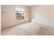 Bedroom featuring neutral carpet and a large window at 10815 N 117Th Pl, Scottsdale, AZ 85259