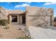 Inviting single-story home with a two-car garage, desert landscaping, and a charming front entry at 10815 N 117Th Pl, Scottsdale, AZ 85259