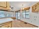 Bright dining area with wood floors, a chandelier, and sliding glass doors at 1152 S Sioux Dr, Apache Junction, AZ 85119